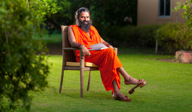 Delhi HC issues summons to Ramdev over complaints of spreading ...