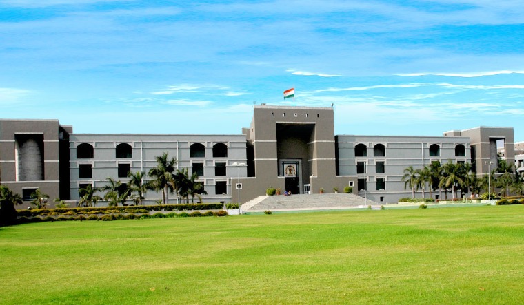 Gujarat HC admits PIL demanding action against cops involved in public flogging in Junagadh - Vimarsana News