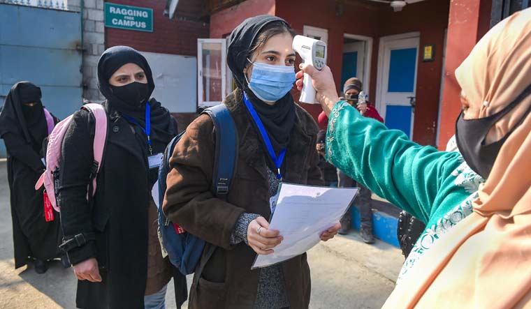 [File] Students undergo temperature checks at an educational institution in Srinagar | PTI