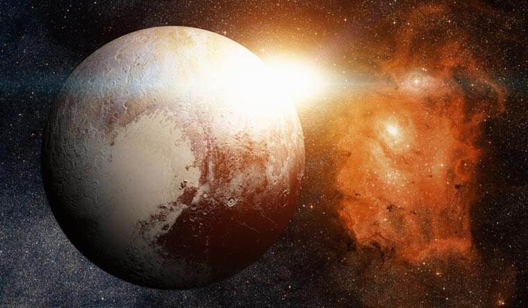 Thin layer of gas protecting Pluto's buried ocean from freezing: Study ...