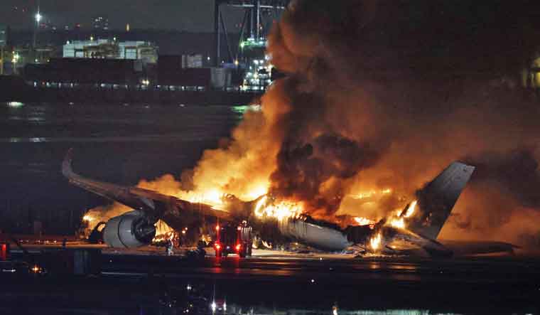 Japan Airlines plane in flames at Tokyo airport, 300 passengers onboard: Reports - Vimarsana News