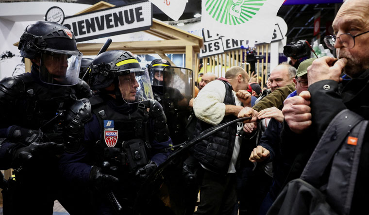 French farmers storm into Paris agriculture fair ahead of Macron's visit - Vimarsana News